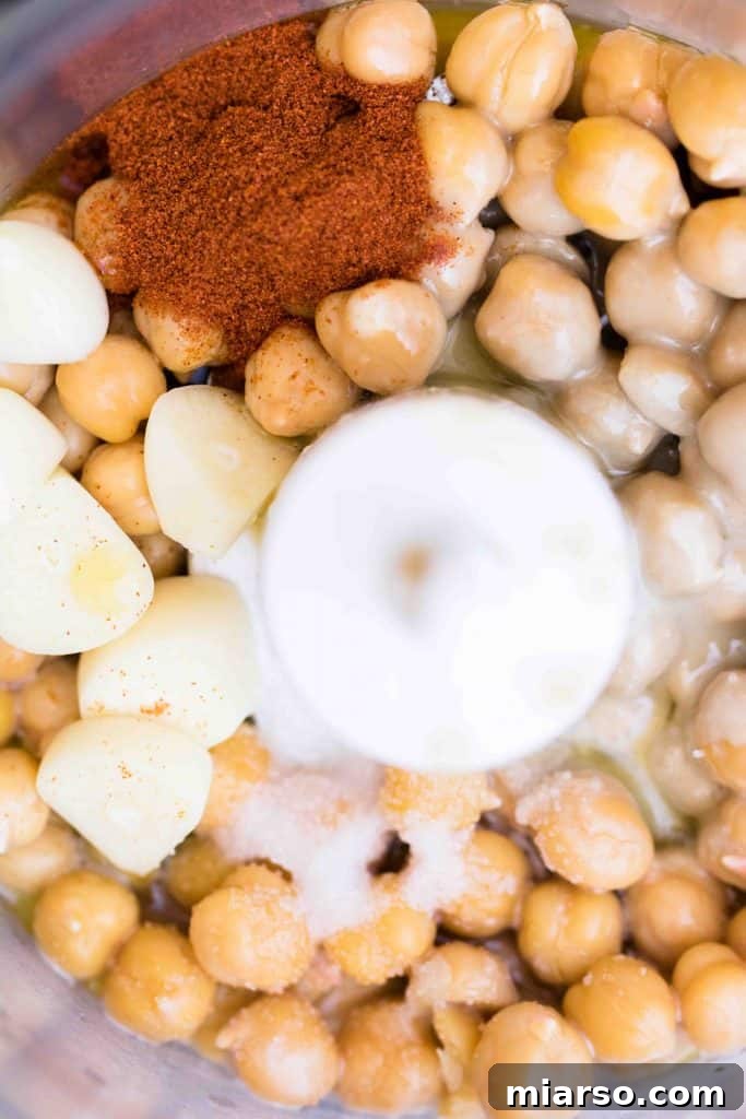 Effortless Mediterranean Hummus Platter 5 Ingredients laid out for making loaded hummus
