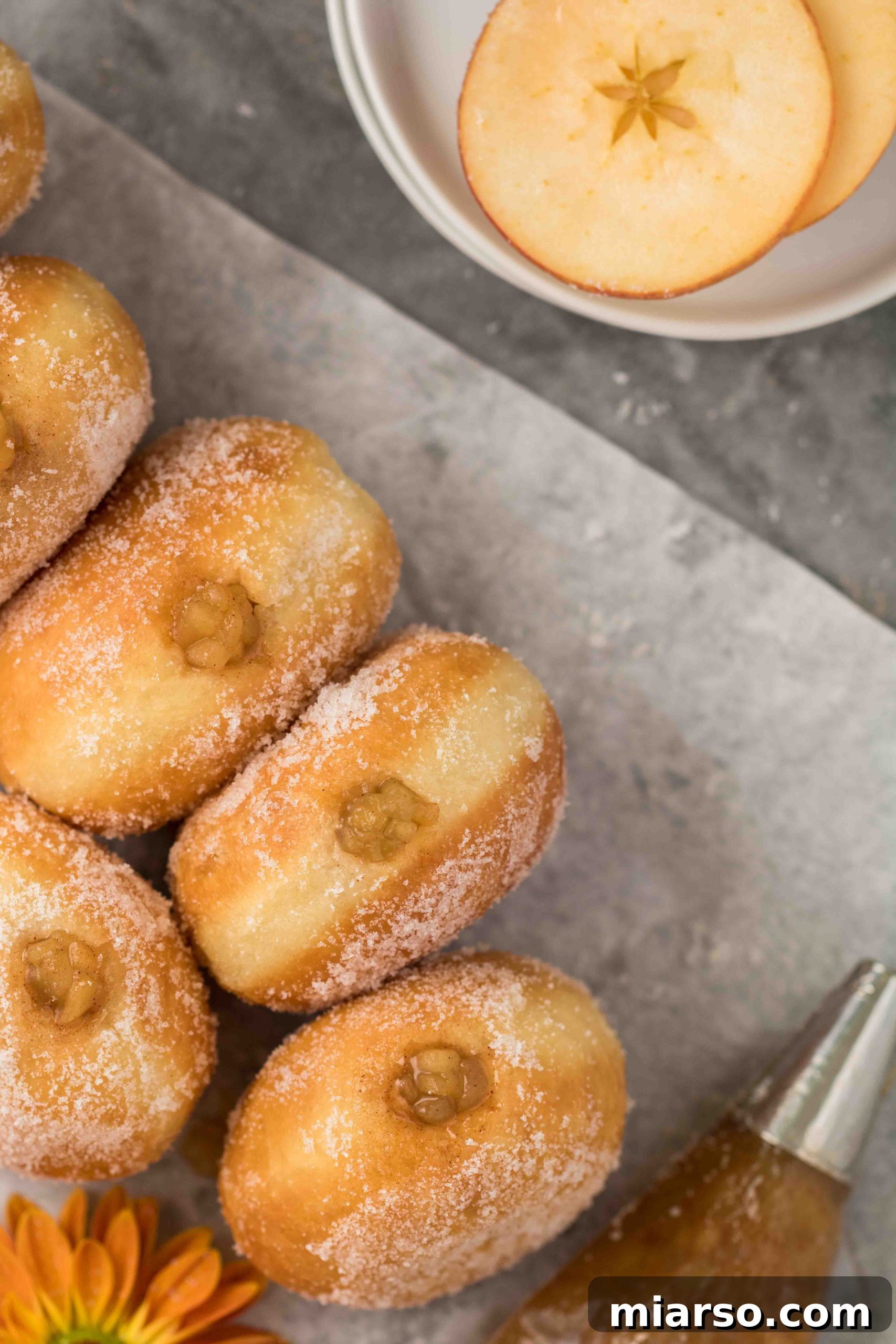 The best apple stuffed donuts recipe for fall, bursting with warm spiced filling