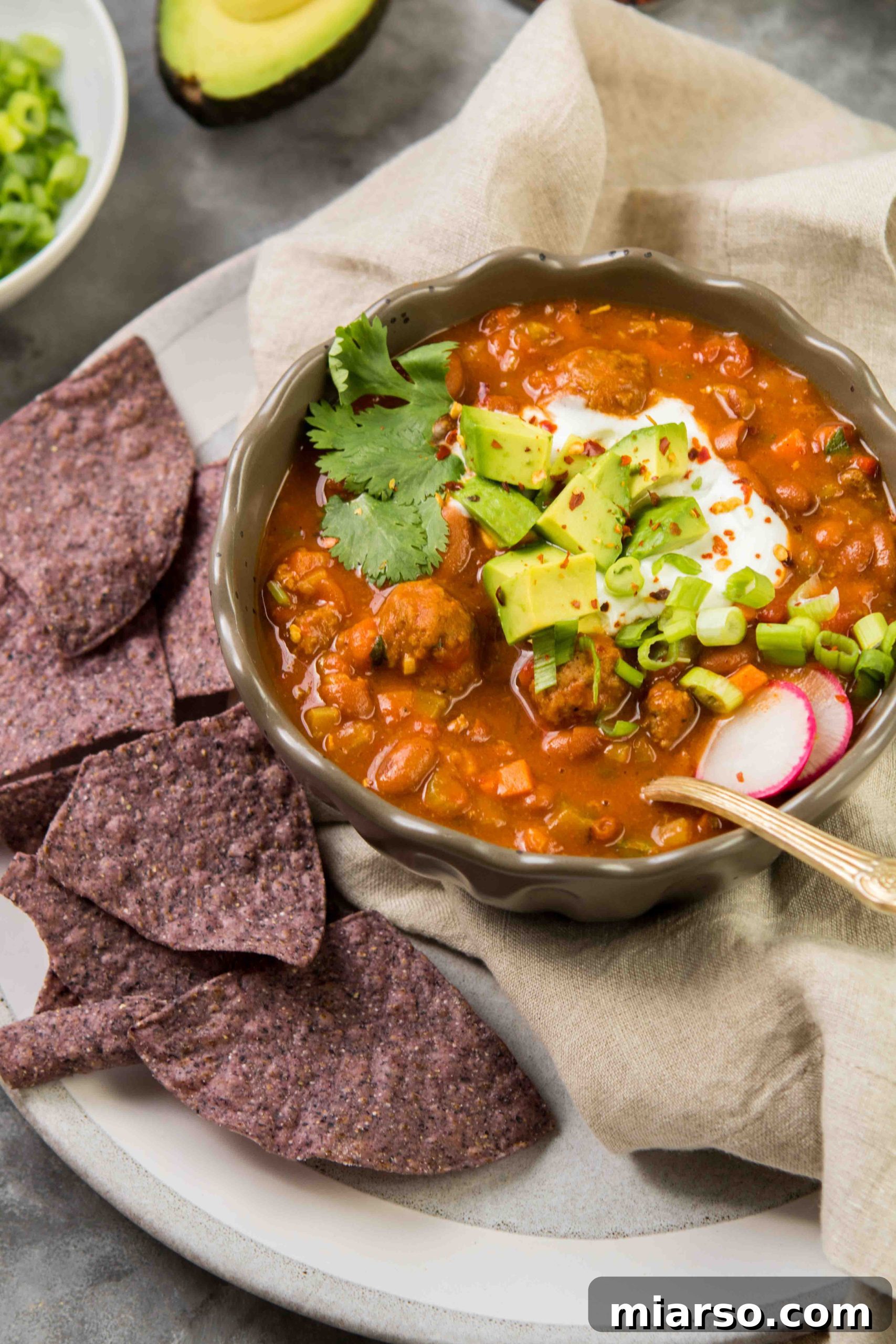 Serving suggestion for Mediterranean inspired chili with toppings