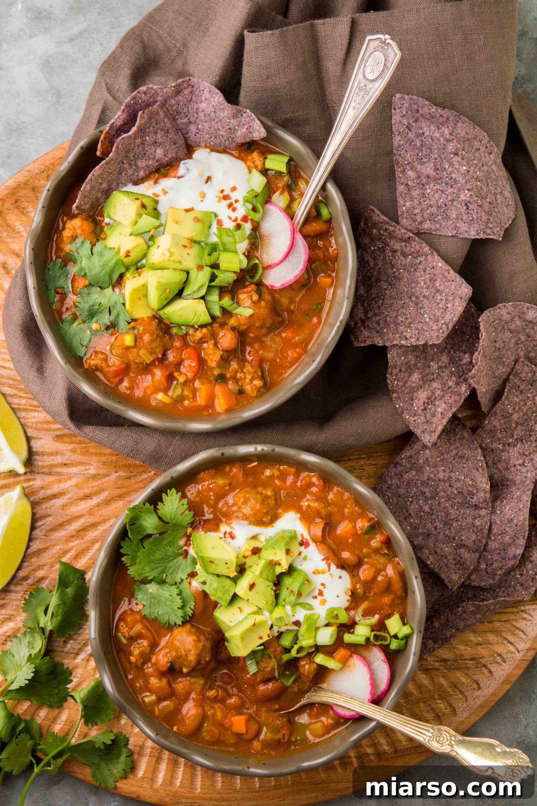 The tastiest Mediterranean chili recipe, garnished with fresh cilantro and sour cream