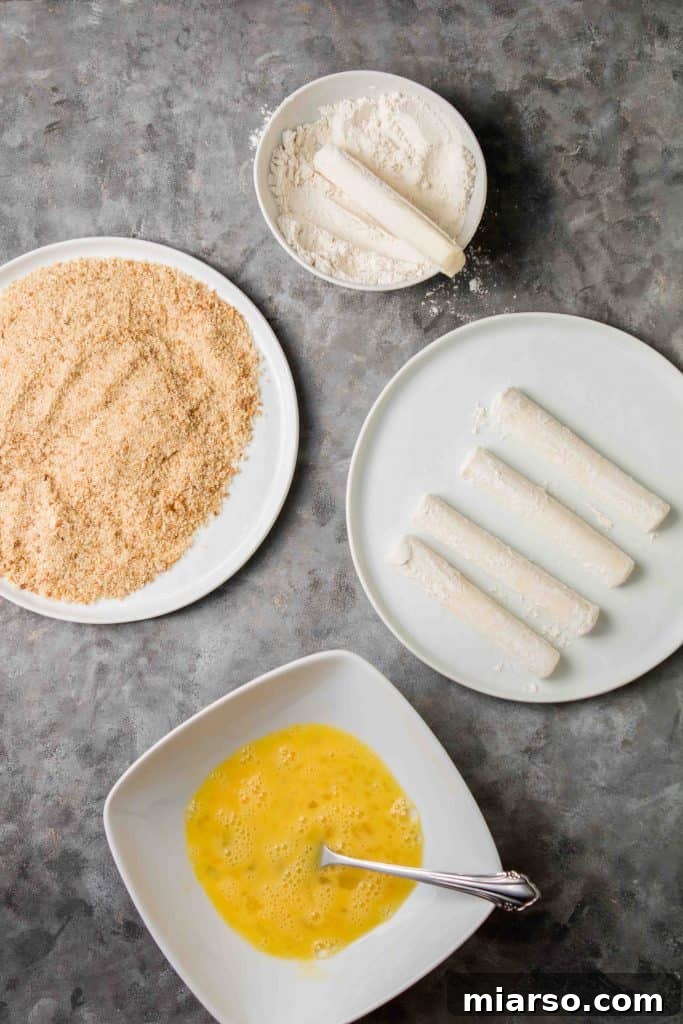 Airfryer'da Kusursuz Mozzarella Çubukları 5 Mozzarella sticks dipped in flour