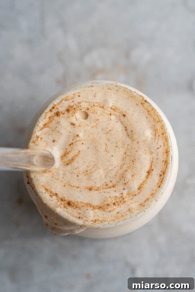 Fall's Ultimate Starbucks Pumpkin Cream Cold Brew 4 A close-up overhead shot of luscious pumpkin cold foam, ready to be poured over cold brew.