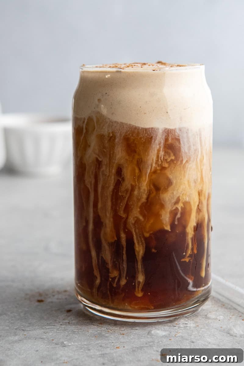 Fall's Ultimate Starbucks Pumpkin Cream Cold Brew 7 A top-down view of a freshly made pumpkin cold foam cold brew, ready to be enjoyed.