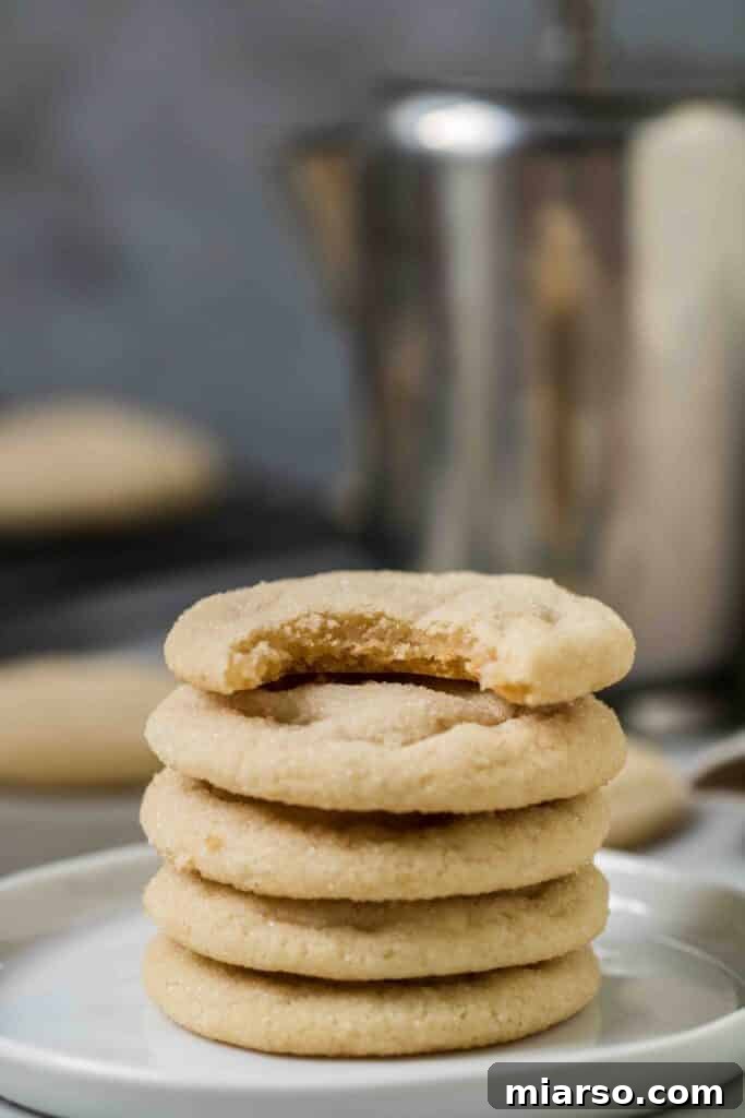 A short stack of festive Christmas sugar cookies, perfectly baked and ready for holiday enjoyment.