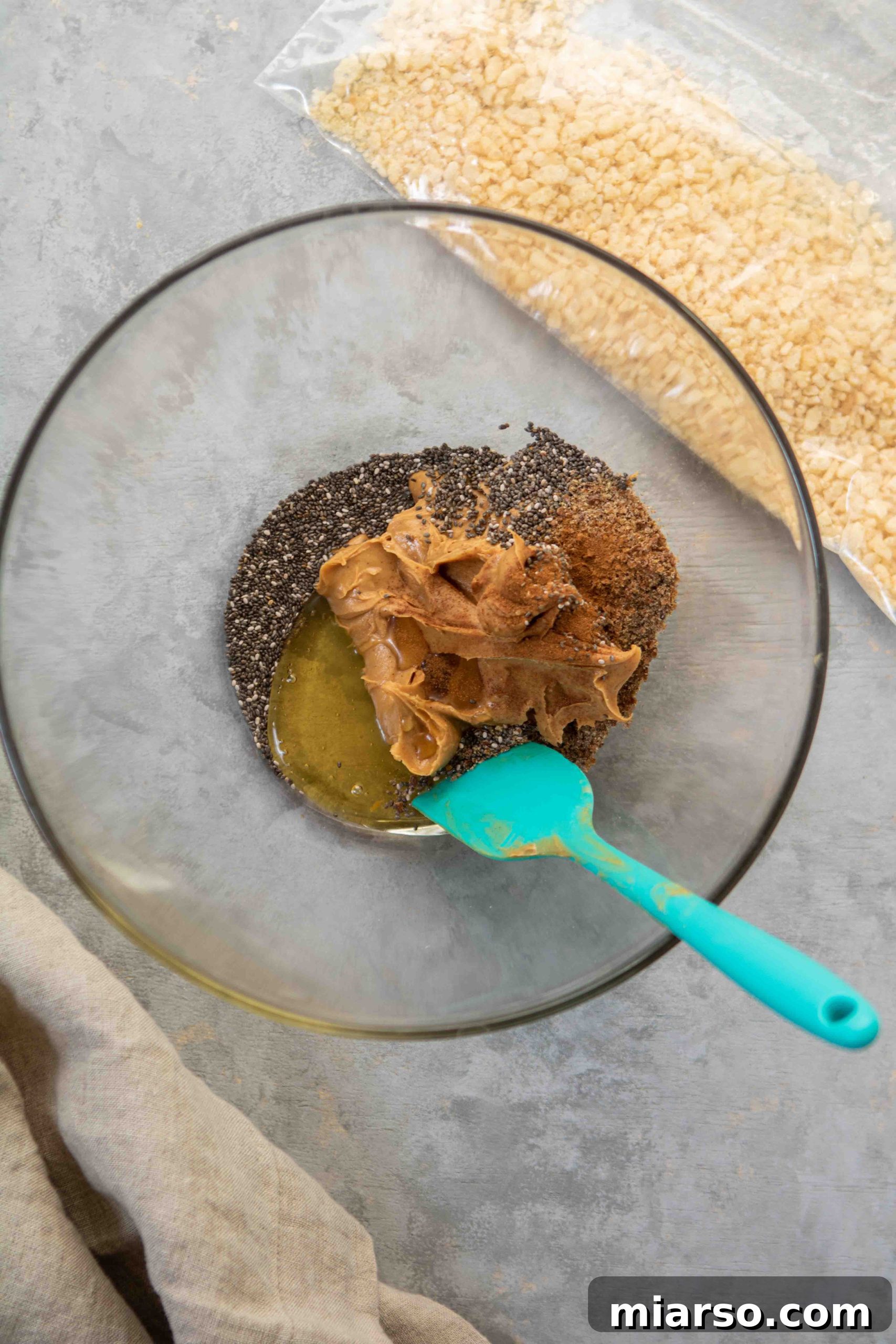 Close up of mixed ingredients for the peanut butter balls before rolling.