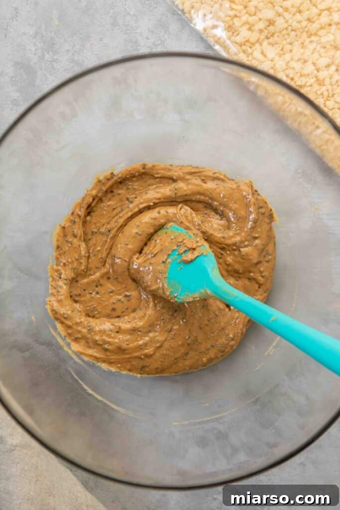 Mixing the peanut butter ball ingredients in a bowl.