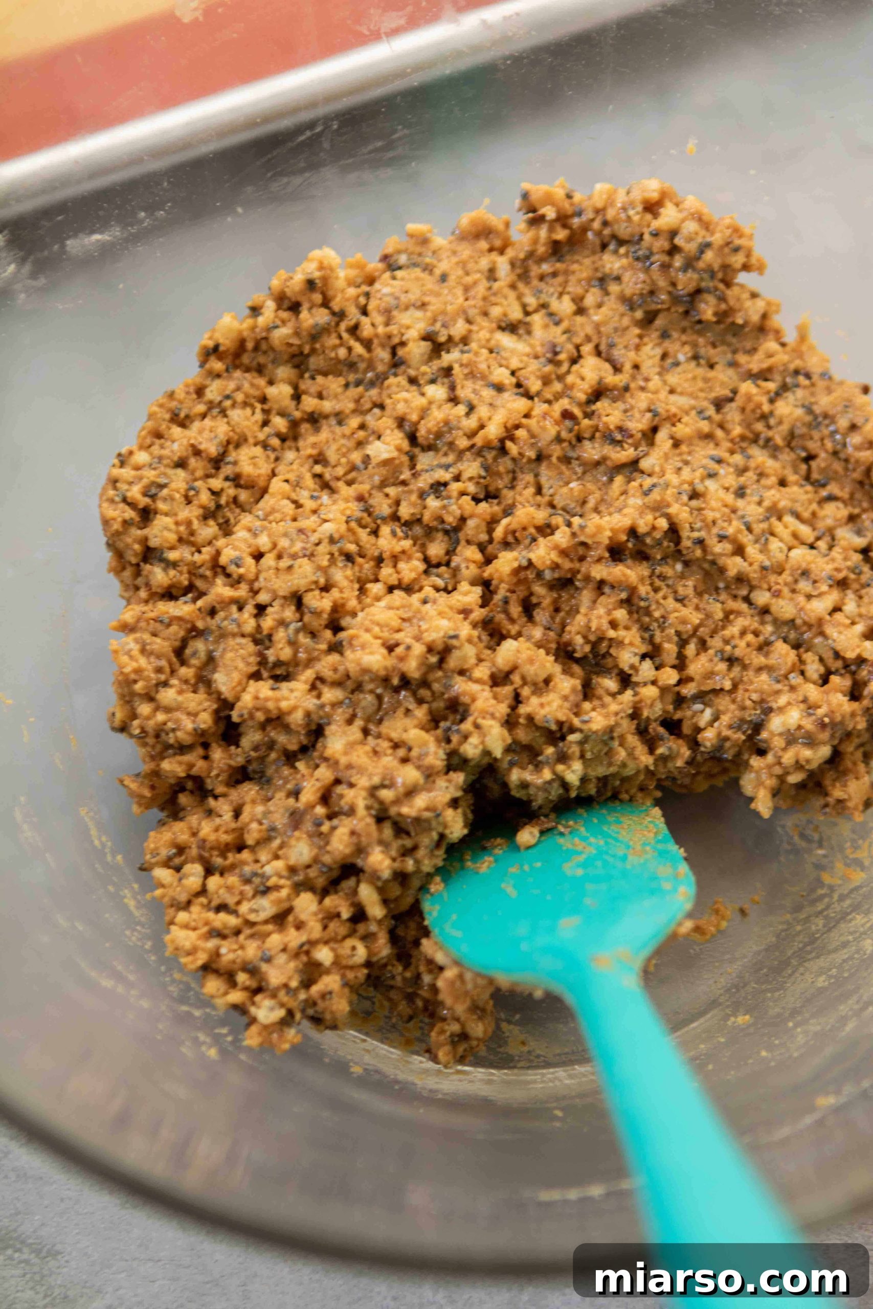 Close up of the peanut butter and rice cereal mixture before rolling.