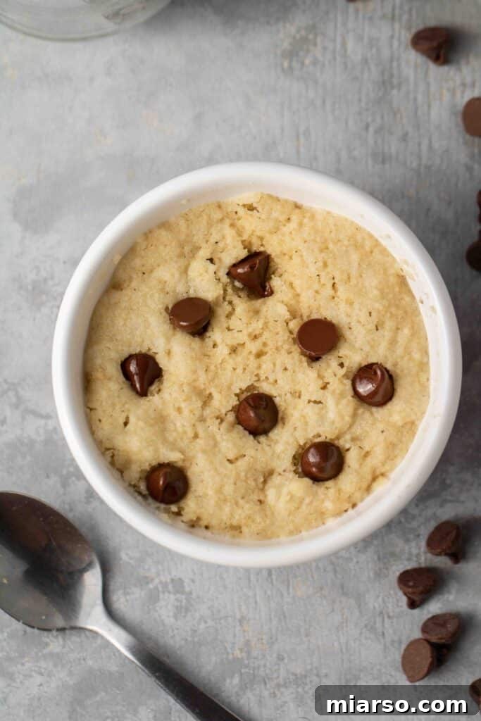 Step-by-step image showing how to mix ingredients for a healthy chocolate chip vegan mug cookie.