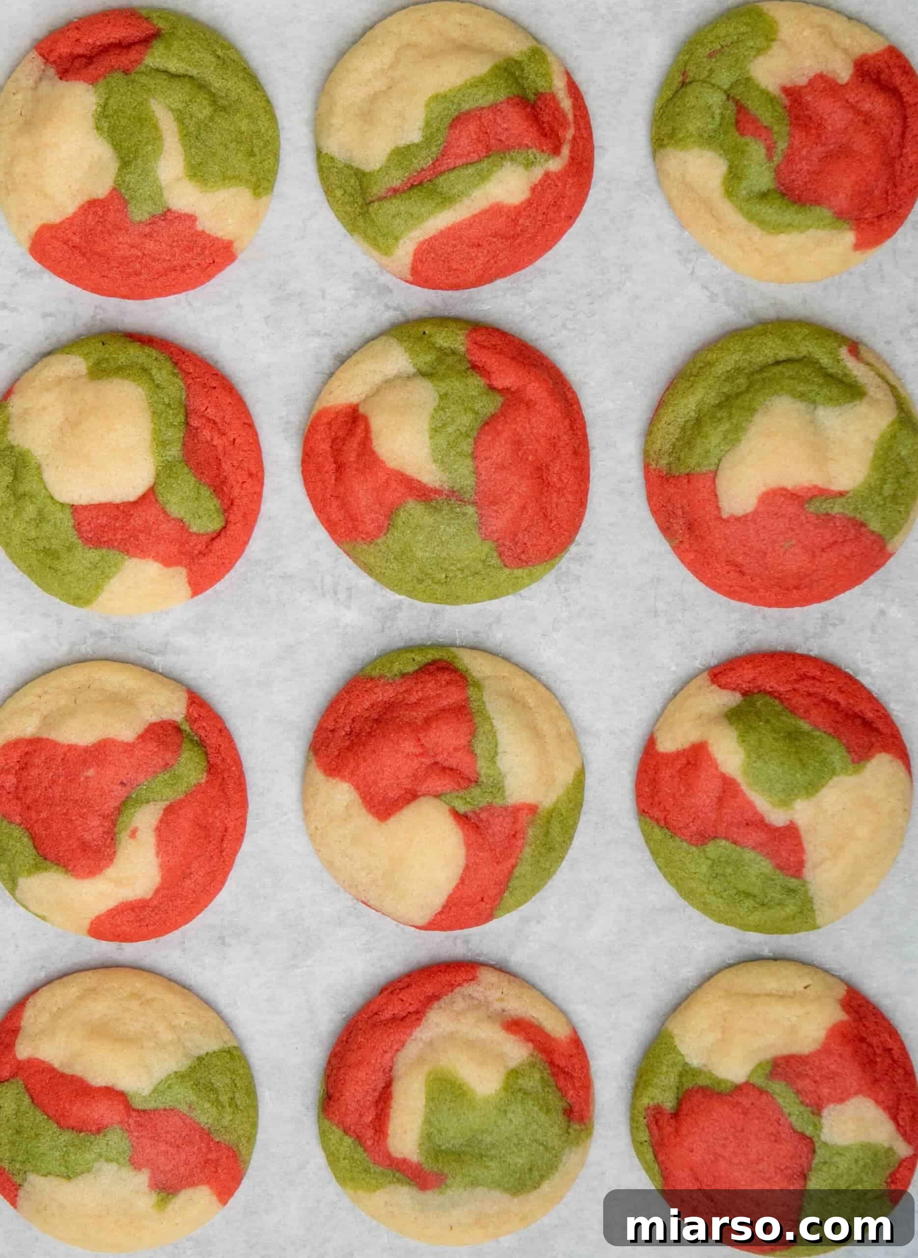 Freshly baked marbled Christmas sugar cookies on a cooling rack