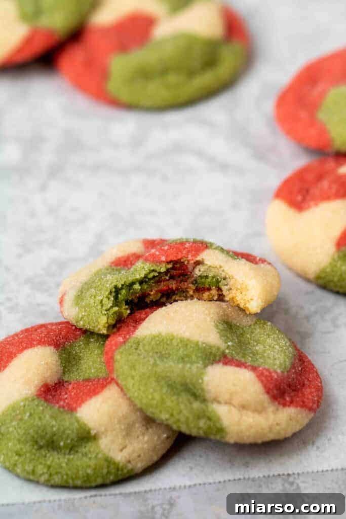 Marbled Christmas Sugar cookie with a bite taken out of it, showing texture