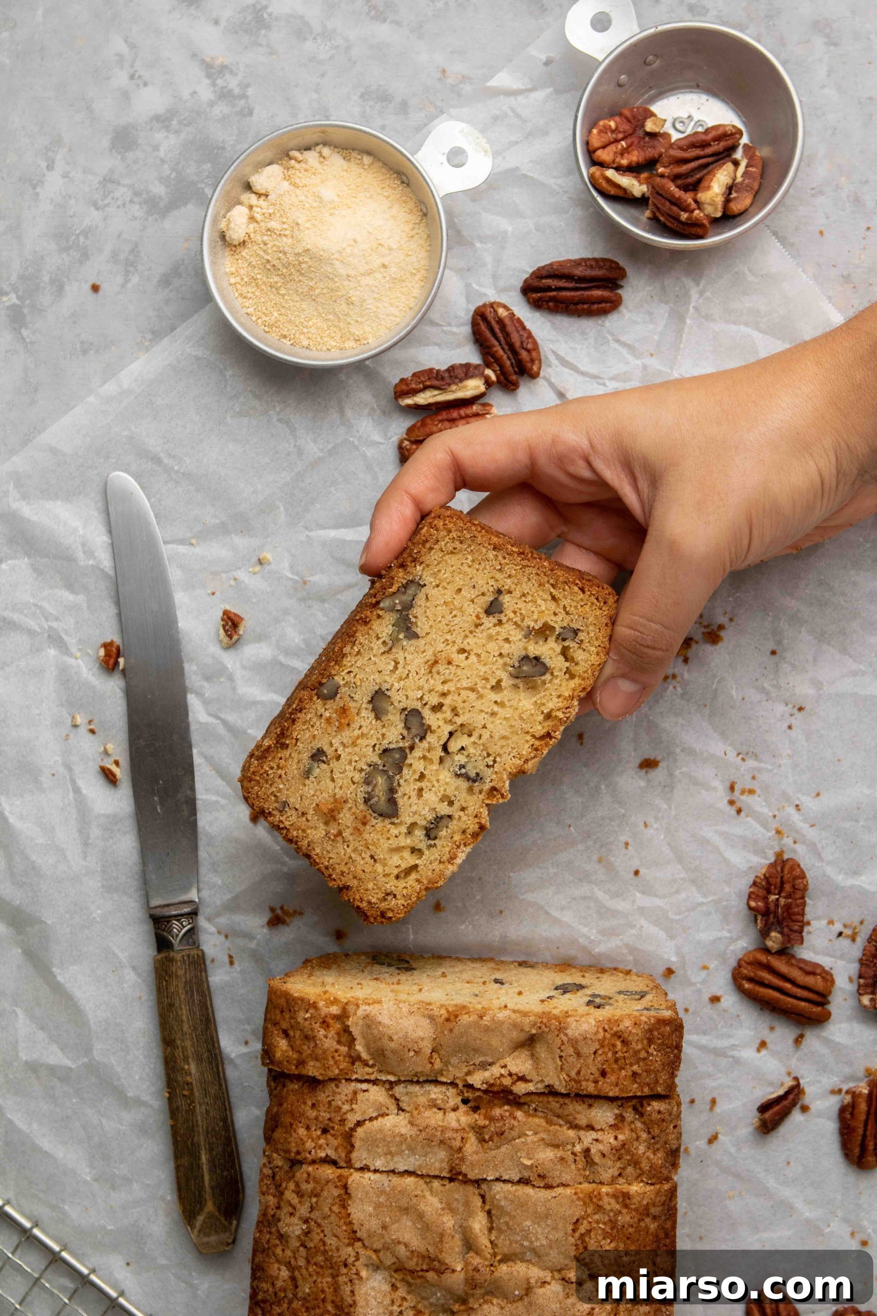 Moist maple pecan bread loaf, freshly baked and golden brown