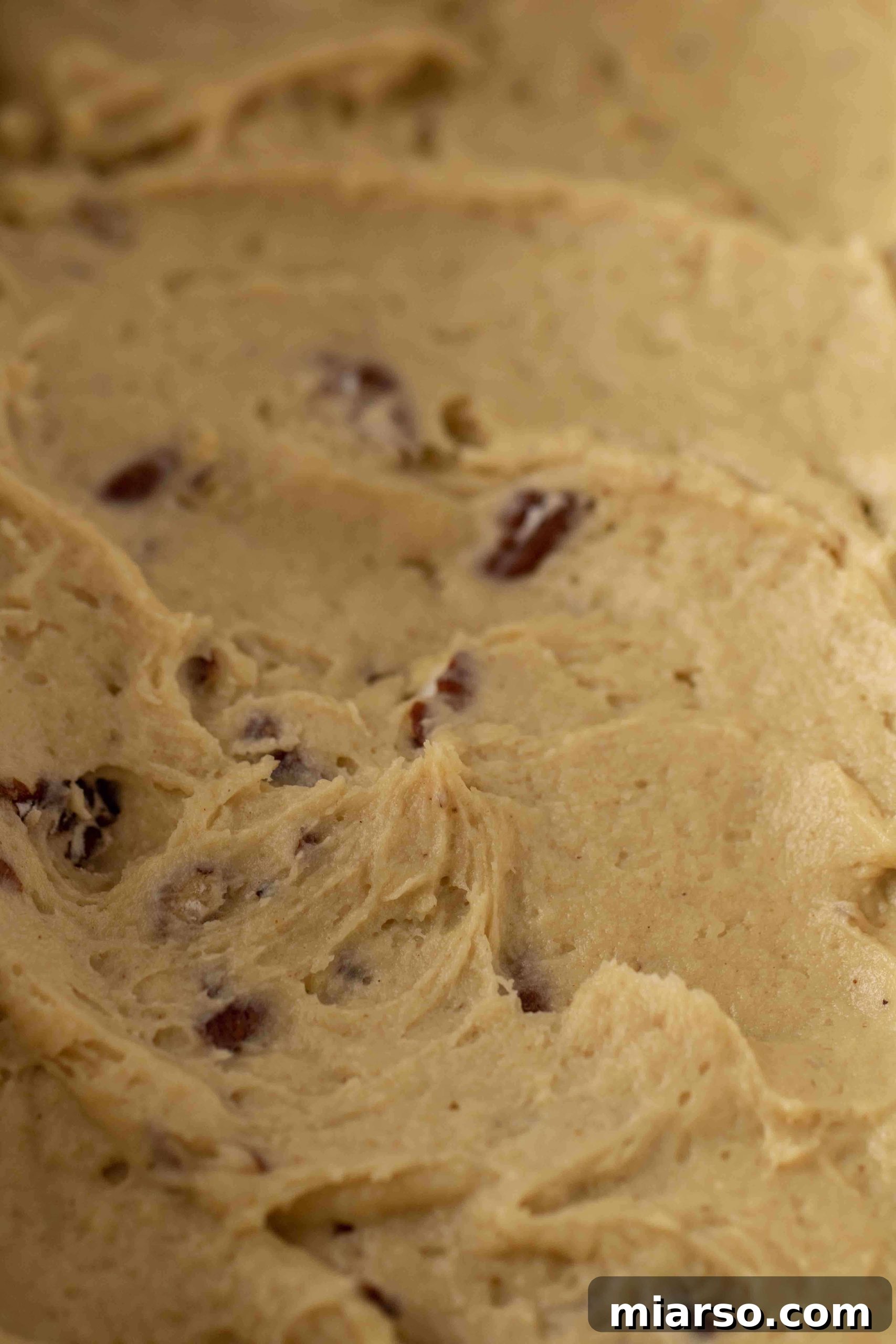Maple and pecan bread batter prepared in the loaf pan, ready for baking