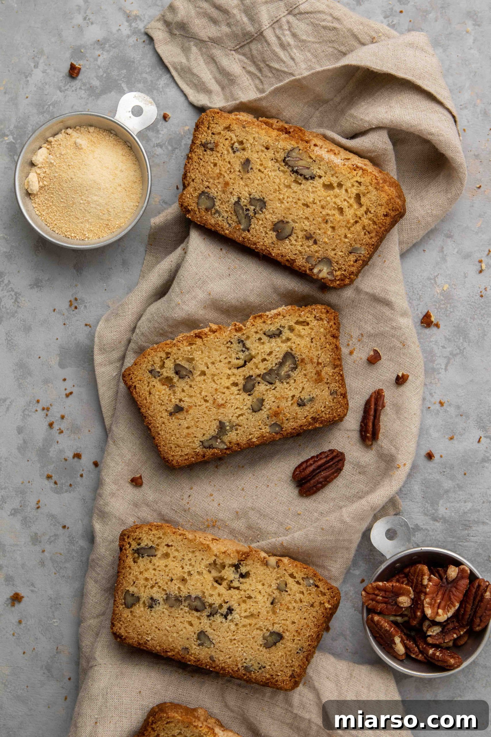Overhead shot of maple pecan bread slices neatly arranged on a napkin, ready to be enjoyed