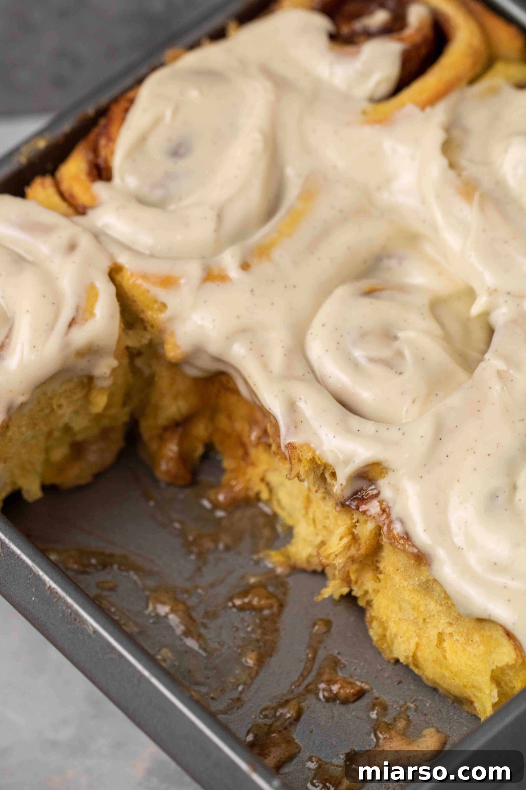 Pumpkin cinnamon rolls with a soft, gooey center