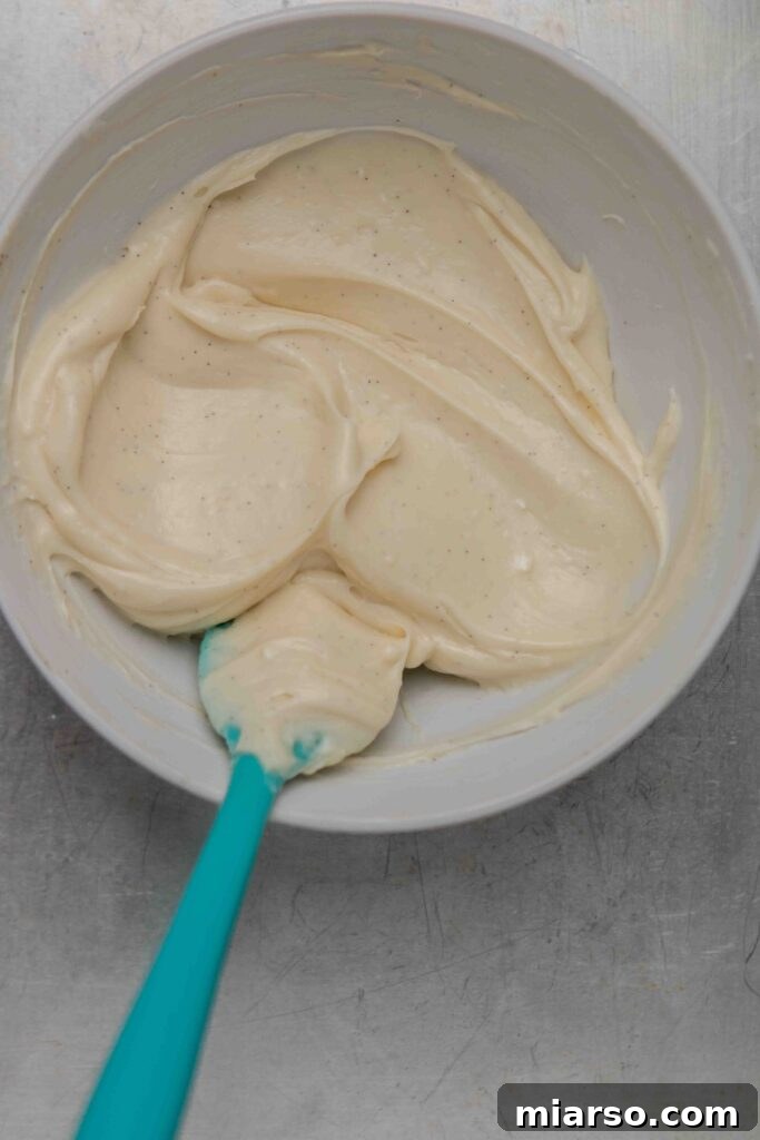Smooth and creamy vanilla bean cinnamon roll icing