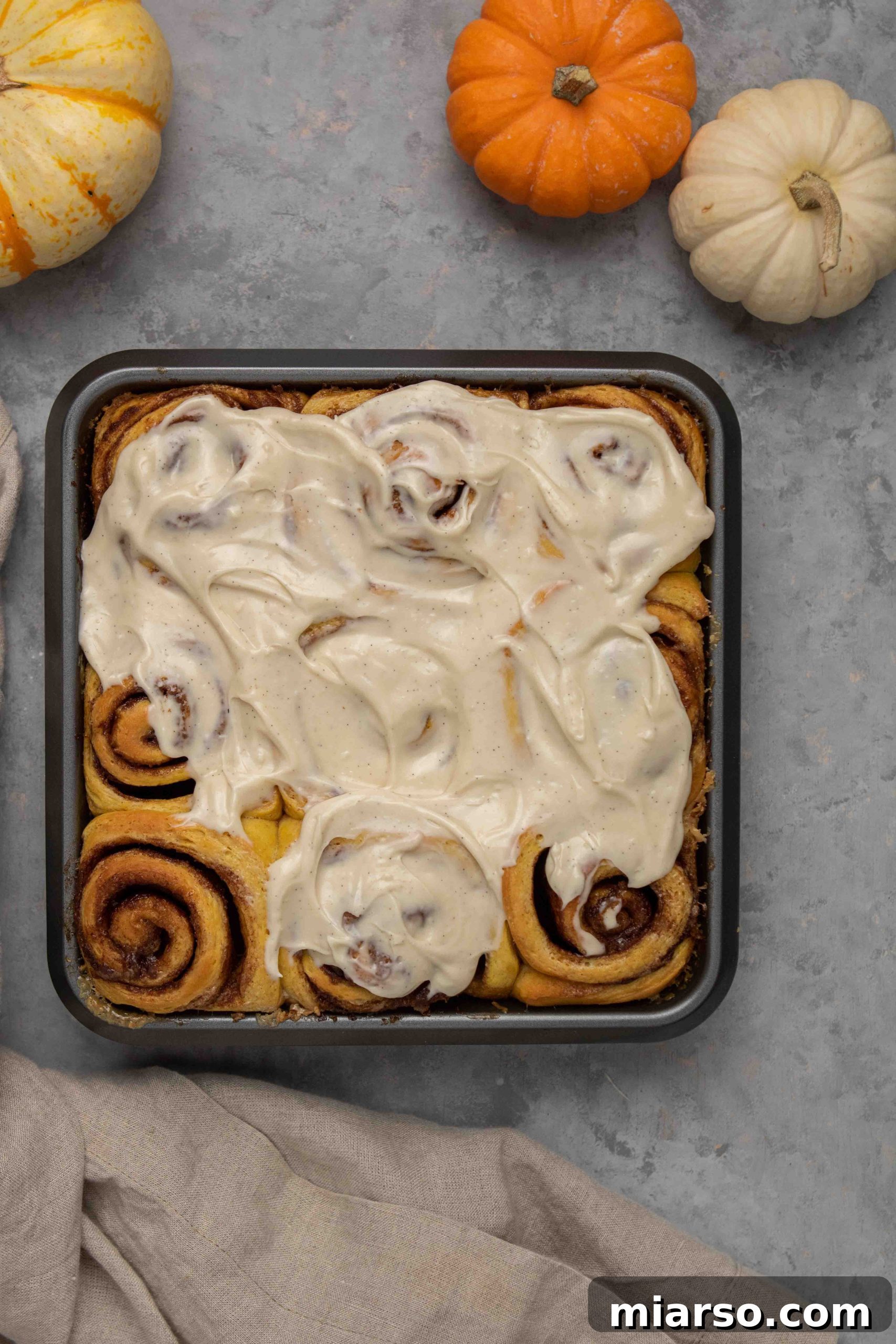 Pumpkin cinnamon rolls with maple cream cheese frosting
