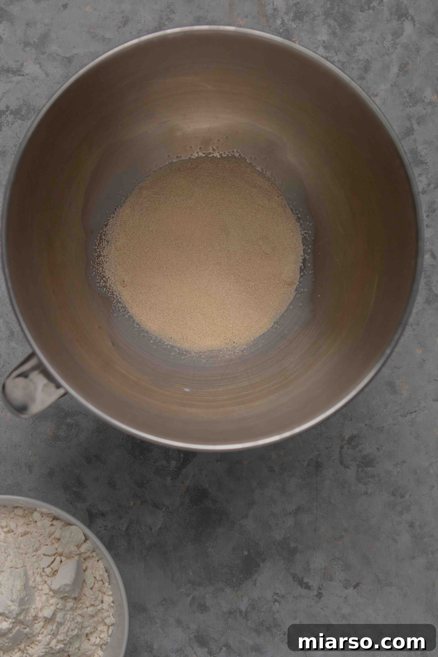 Yeast blooming in warm milk and sugar mixture