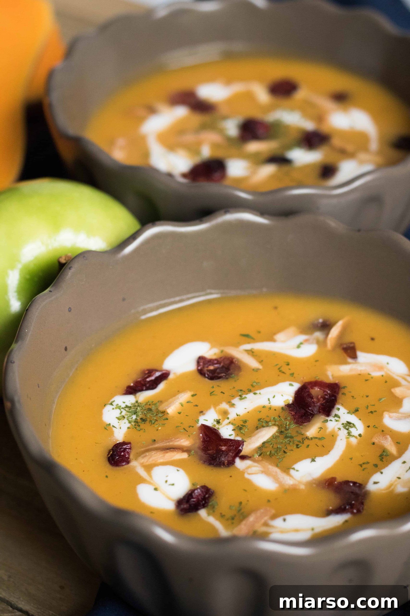 Delicious Butternut Squash Soup in a bowl garnished with fresh herbs