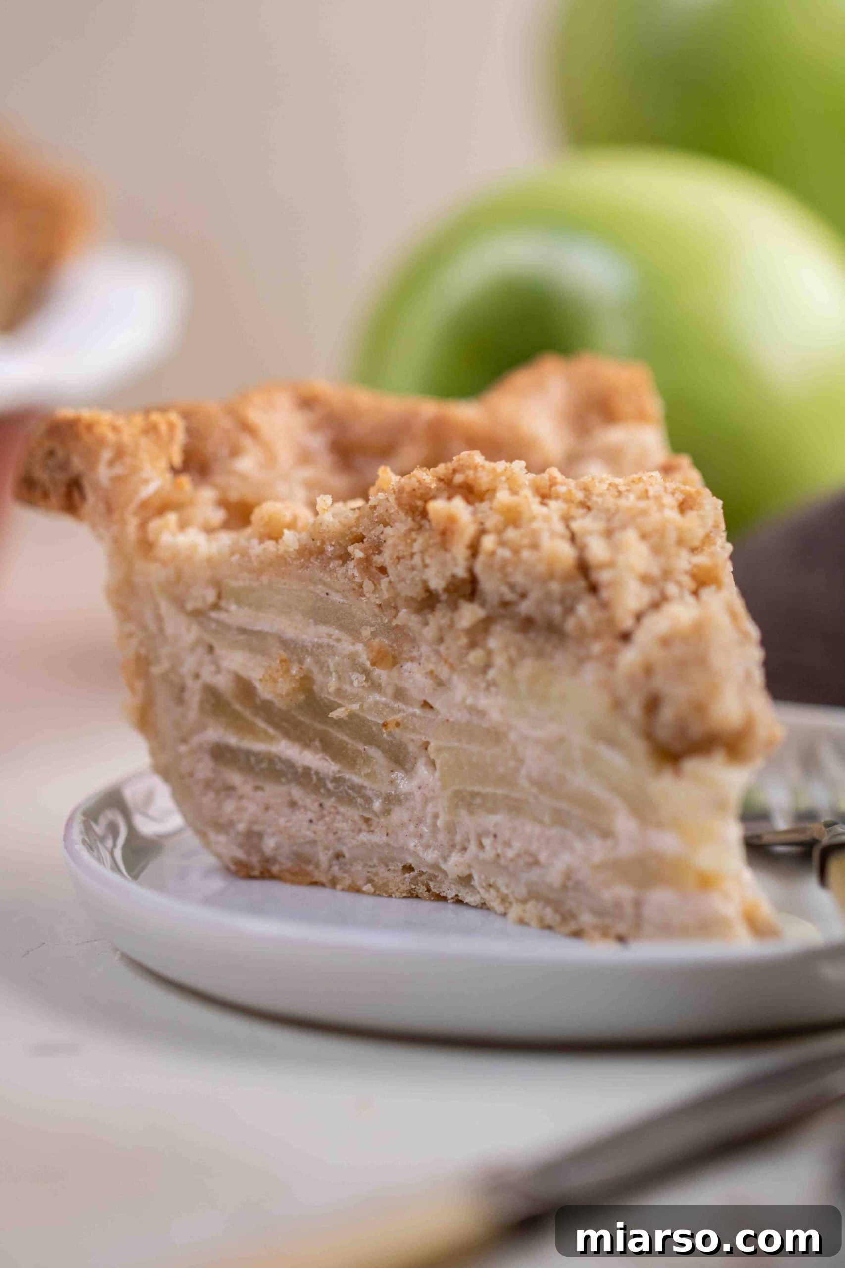Close up of Apple Pie with Crumb Topping, showing golden crumbs