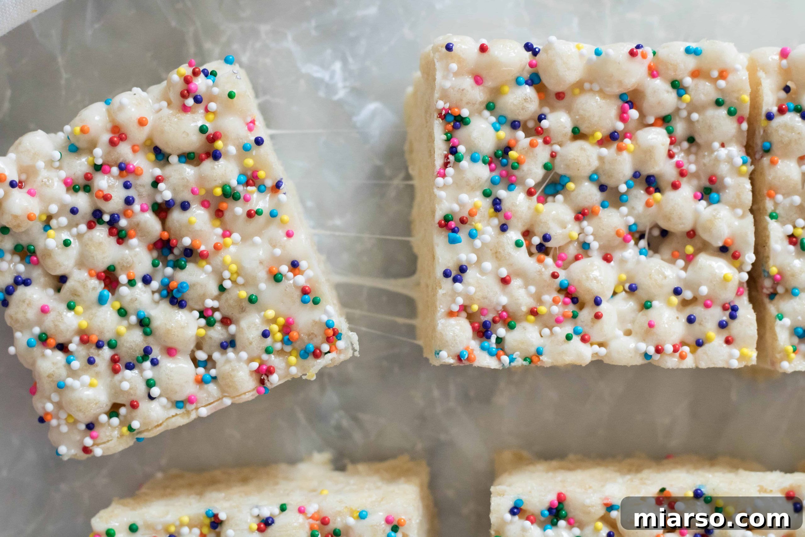 Quinoa Pop Krispie Treats cut into squares, with one piece missing