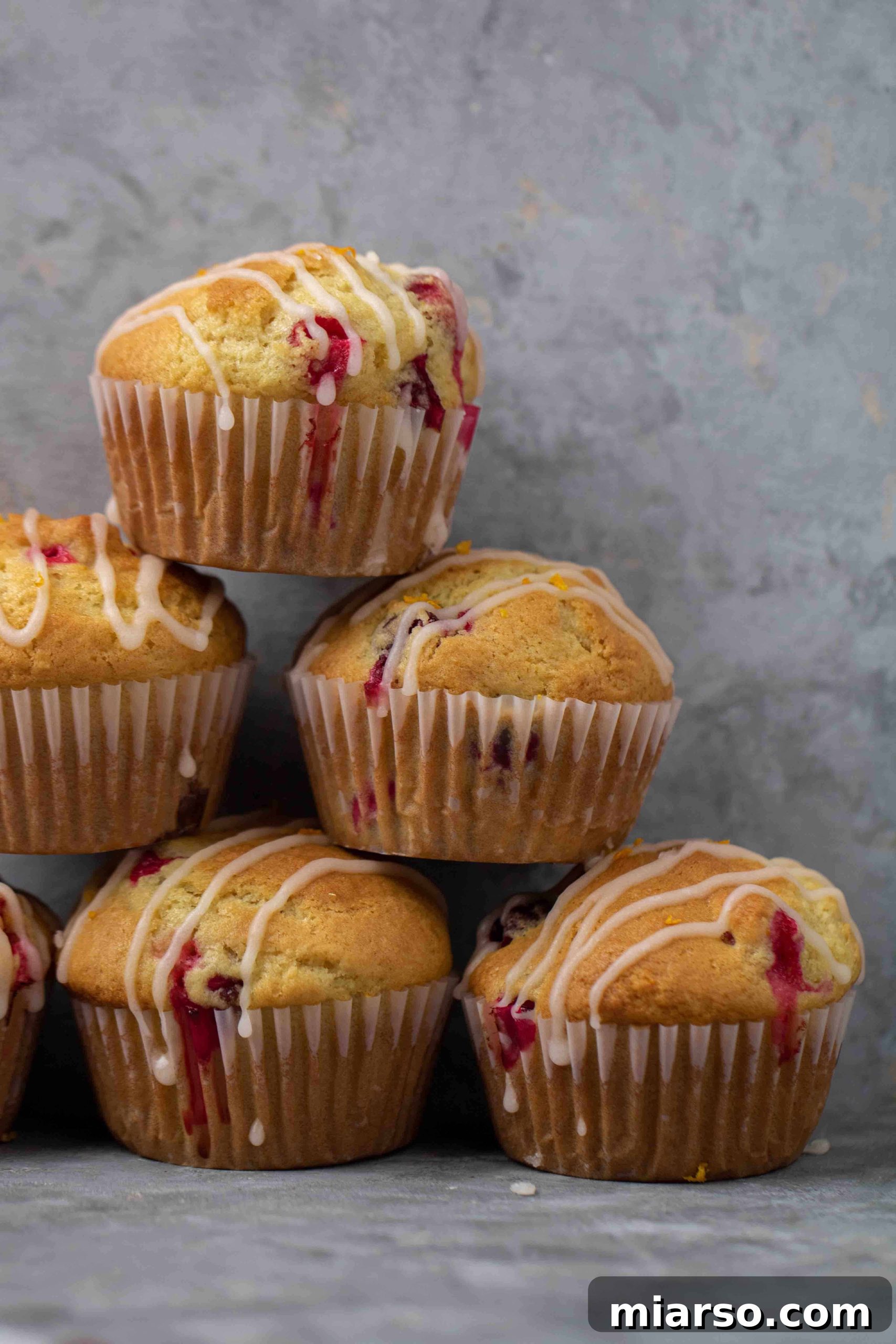 Stack of orange cranberry muffins