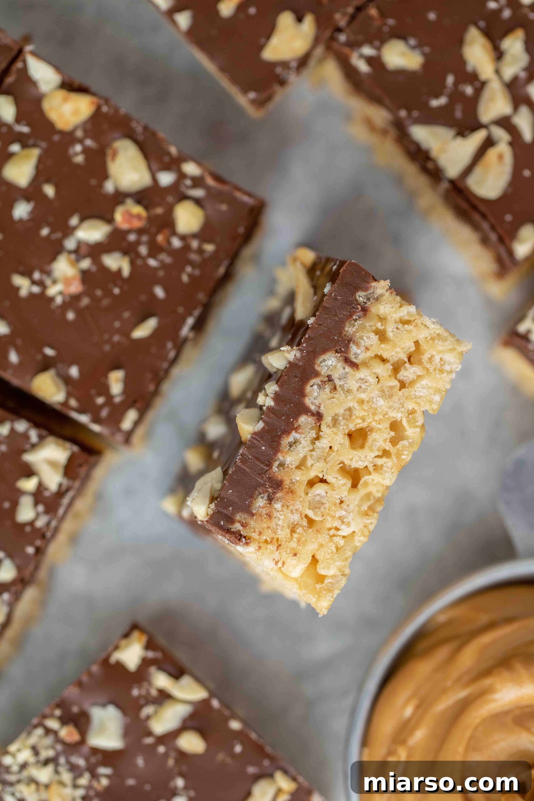 No-Bake Chocolate Peanut Butter Crispy Bars 14 Close up of chocolate peanut butter rice krispie treats showing texture