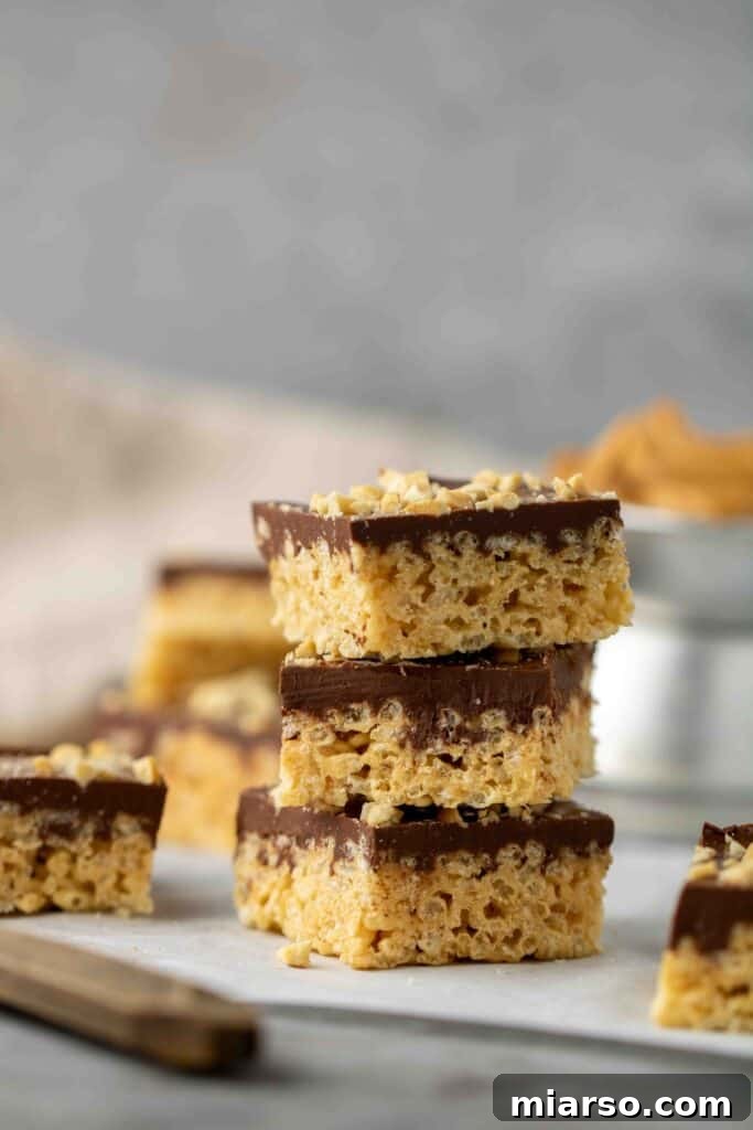 No-Bake Chocolate Peanut Butter Crispy Bars 15 Stack of perfectly cut peanut butter rice krispy treats