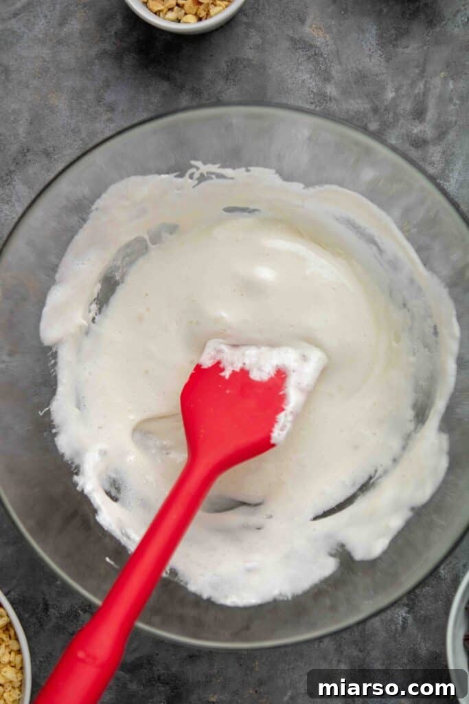 No-Bake Chocolate Peanut Butter Crispy Bars 5 Melted marshmallows in a bowl, ready for mixing