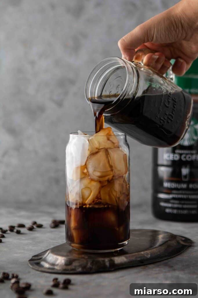 Starbucks Velvety Vanilla Cold Brew 6 Close-up of glass mug filled with cold brew coffee and ice, illustrating what cold brew is.