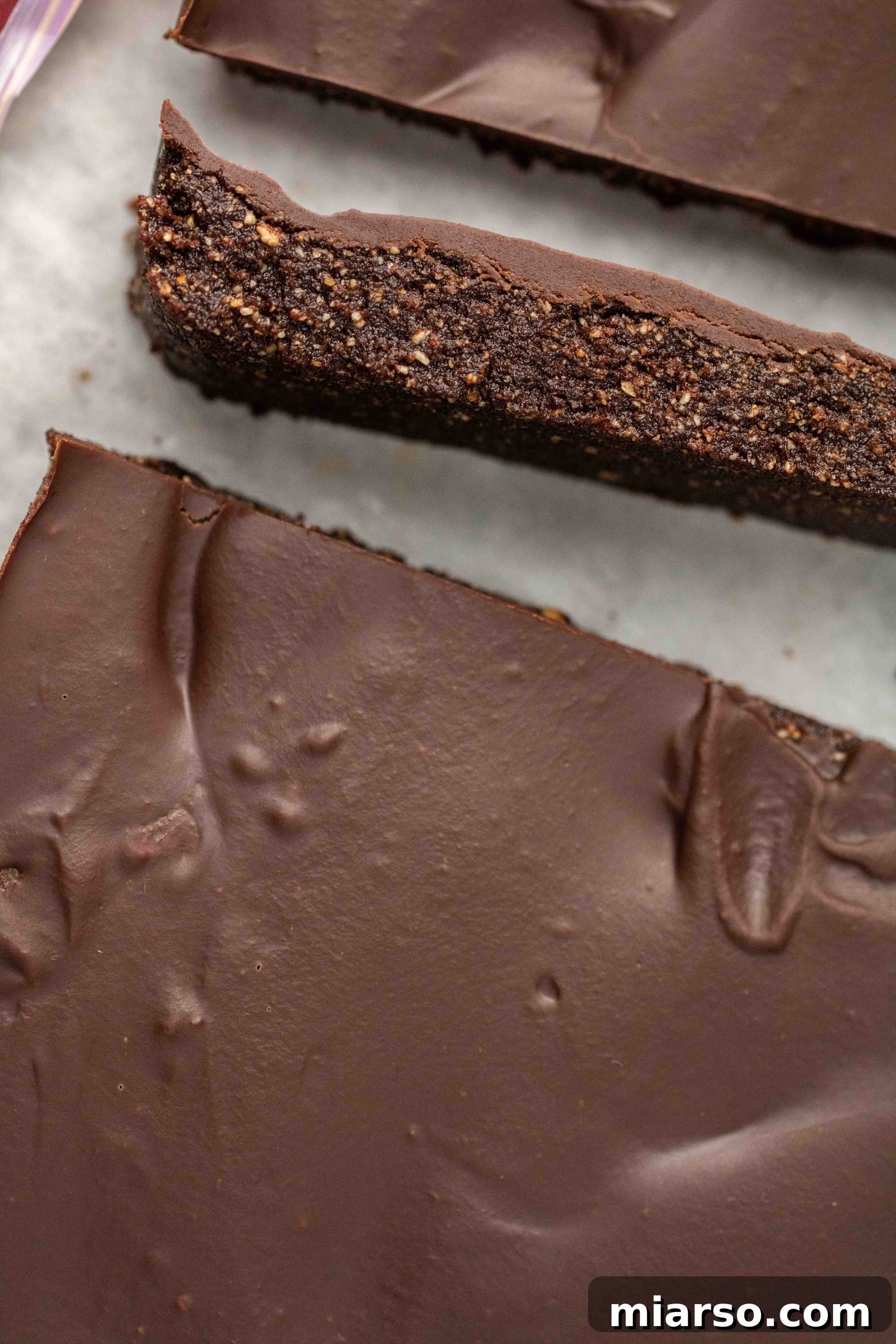 Perfectly sliced vegan chocolate hazelnut bar, ready to be served.