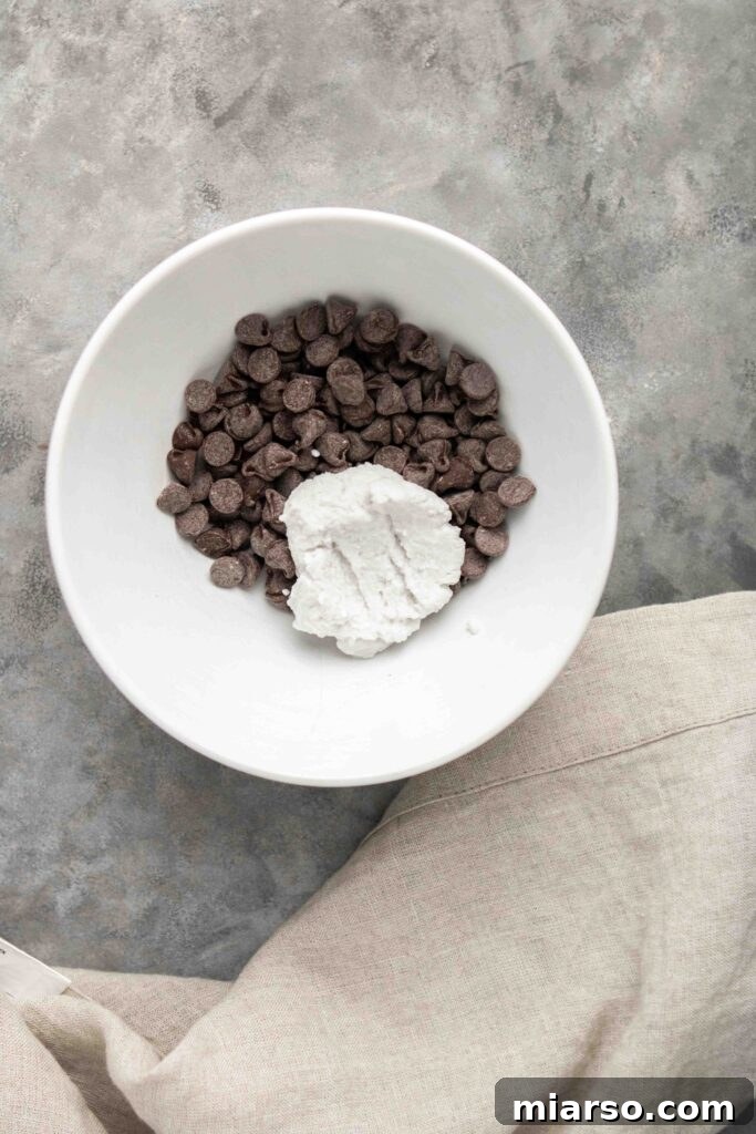 Step-by-step guide: Melting dairy-free chocolate chips with coconut cream for ganache.