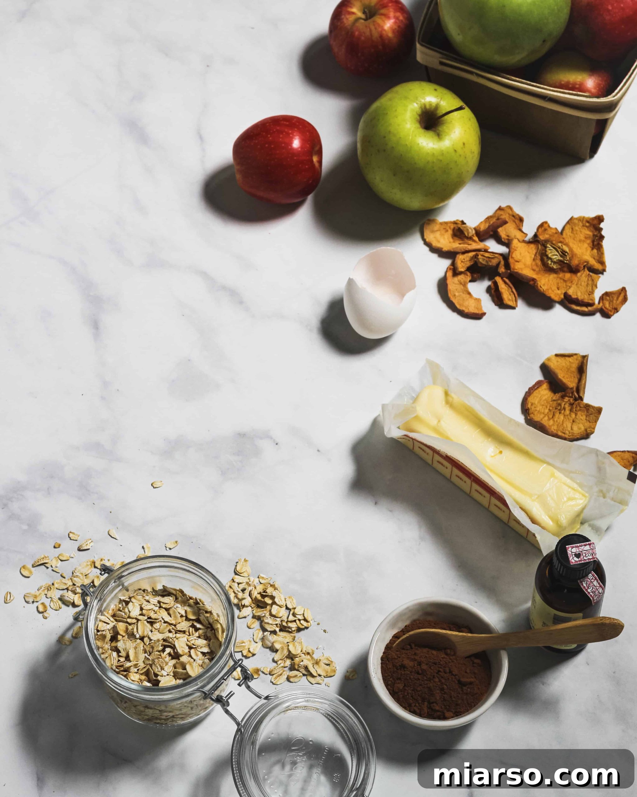 Cozy Apple Cinnamon Oat Cookies 2 Delicious Apple Cinnamon Oatmeal Cookies on a cooling rack, perfectly golden brown and ready to enjoy.