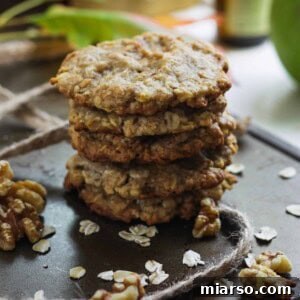 Cozy Apple Cinnamon Oat Cookies 4 Freshly baked Apple Cinnamon Oatmeal Cookies on a cooling rack