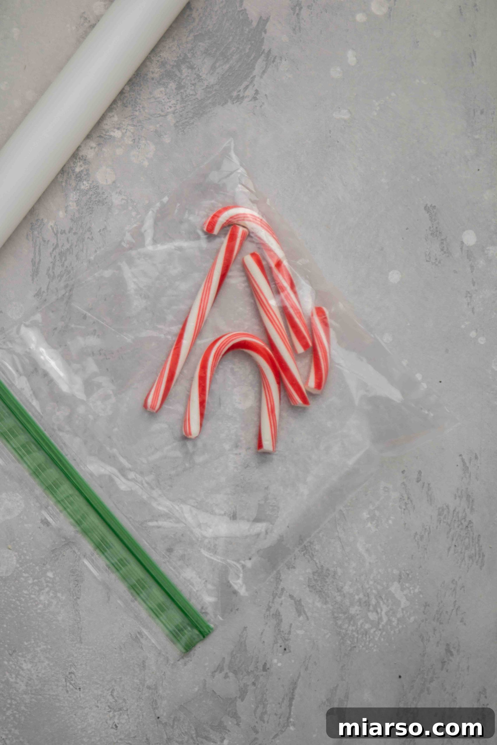 Image showing shortbread dough being rolled out on a floured surface.
