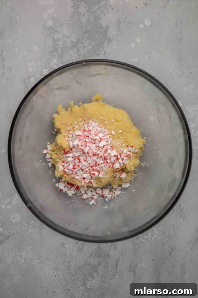 Image showing shortbread cookie cutouts placed on a baking sheet.