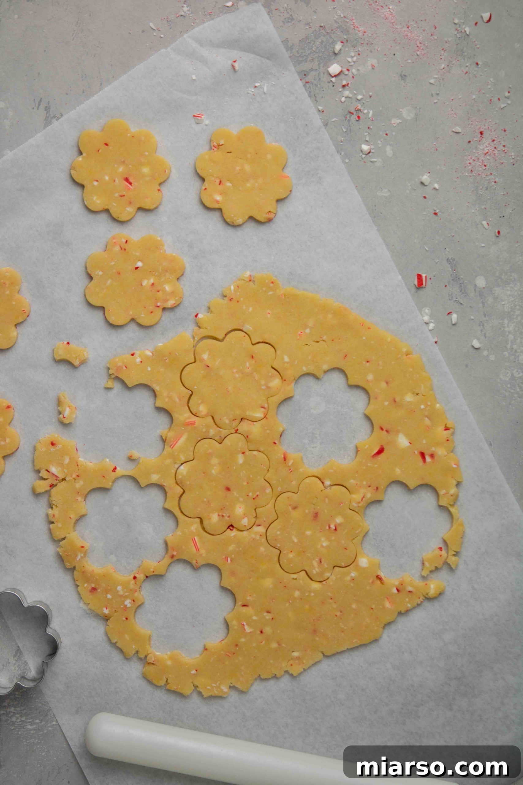Image of freshly baked peppermint shortbread cookies cooling on a wire rack.