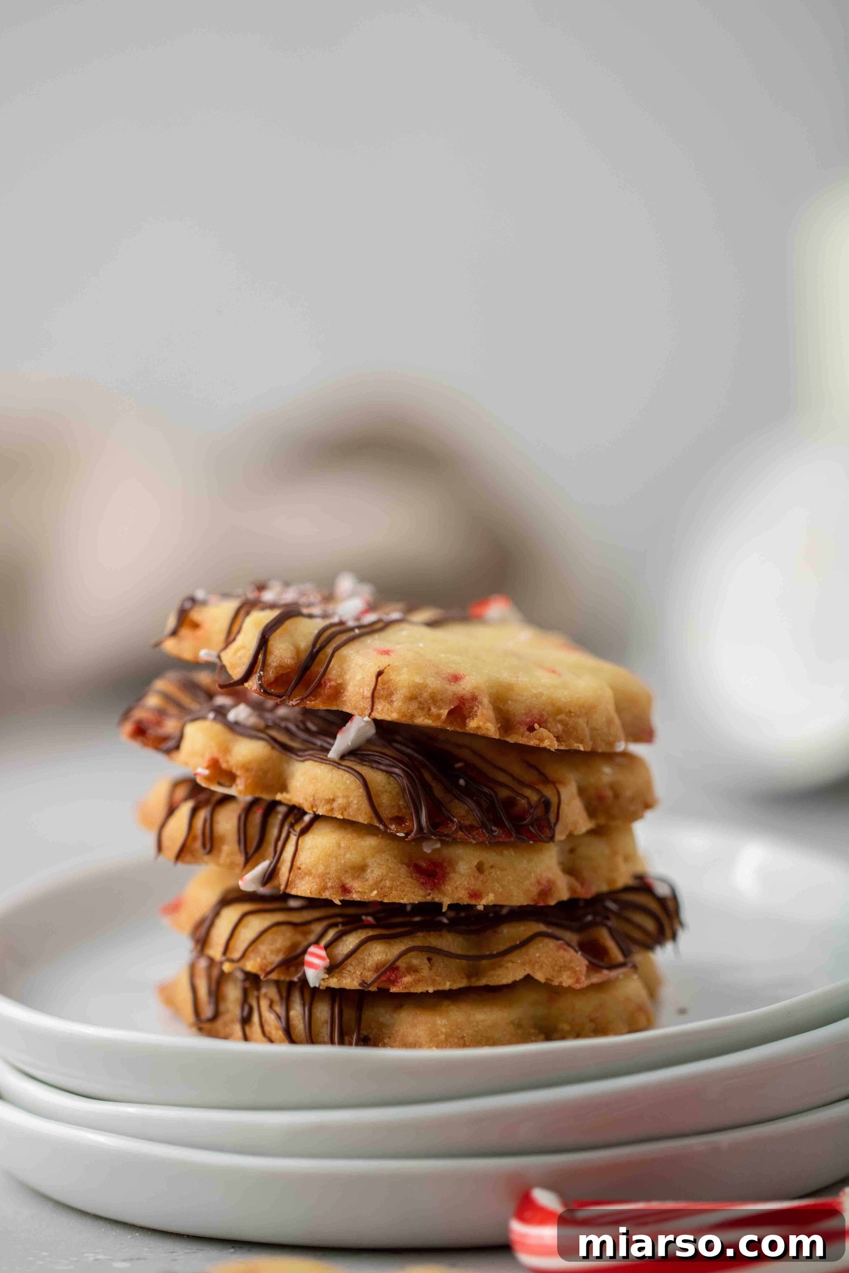 Close-up of a stack of peppermint candy cane cookies, perfect for Christmas gifting.