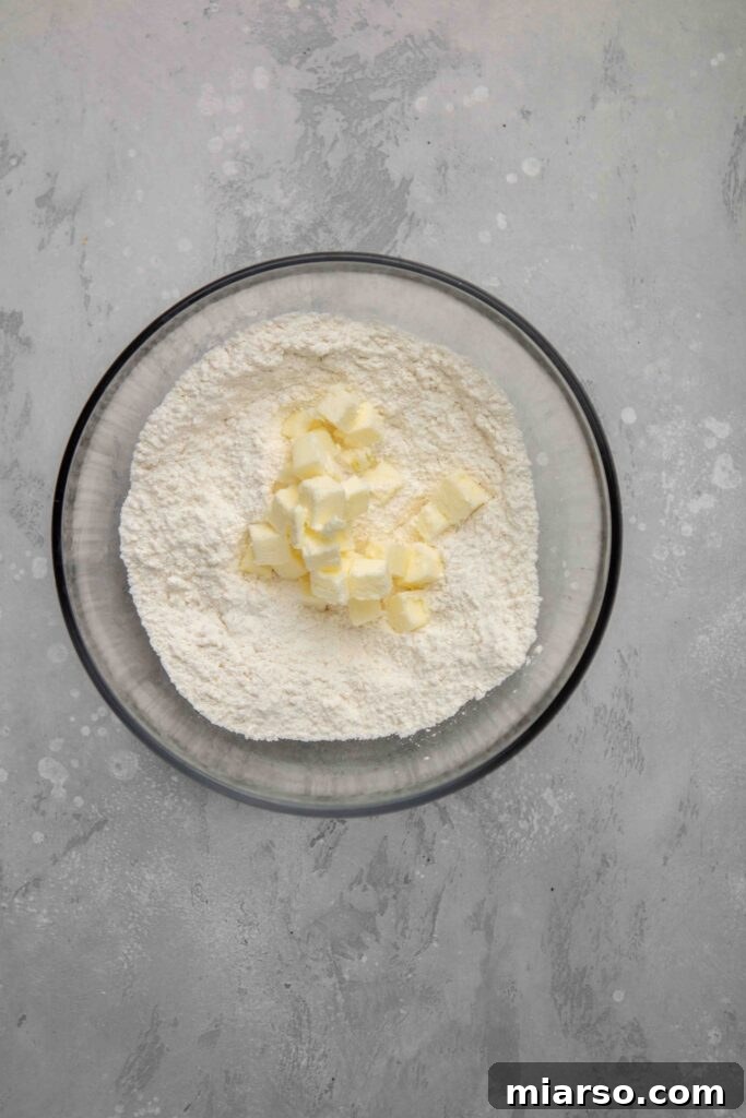 Image showing flour and sugar being whisked in a bowl.