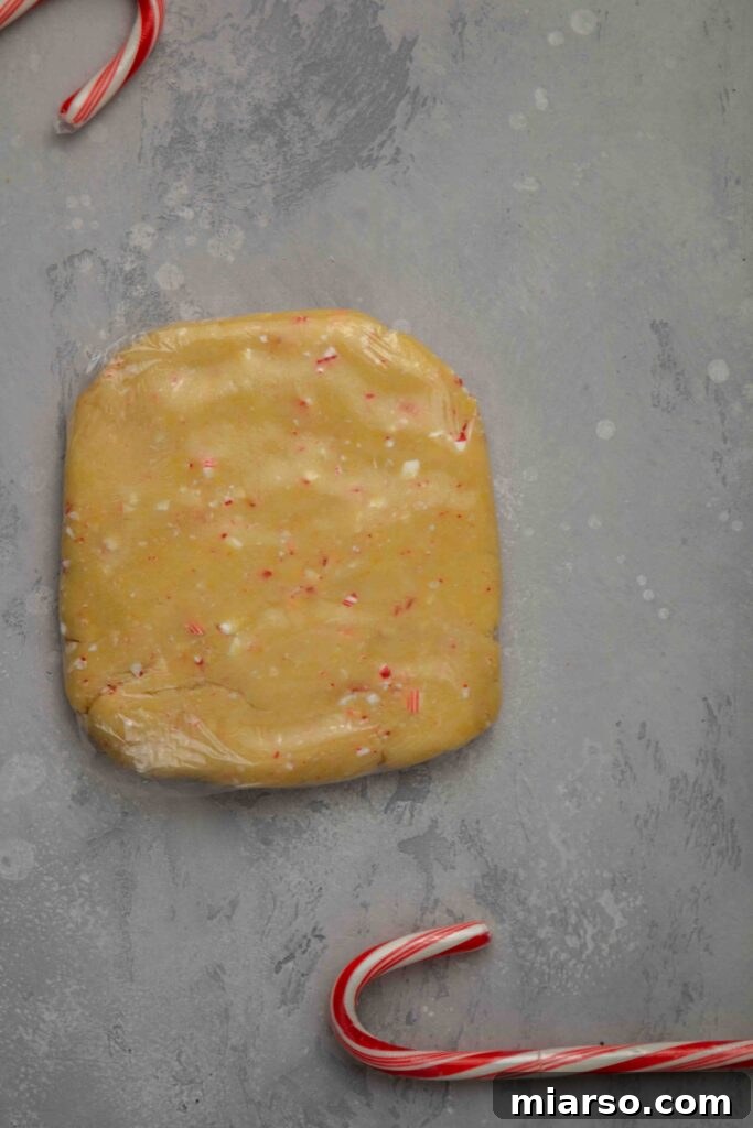 Image showing crushed candy canes being mixed into the dough.