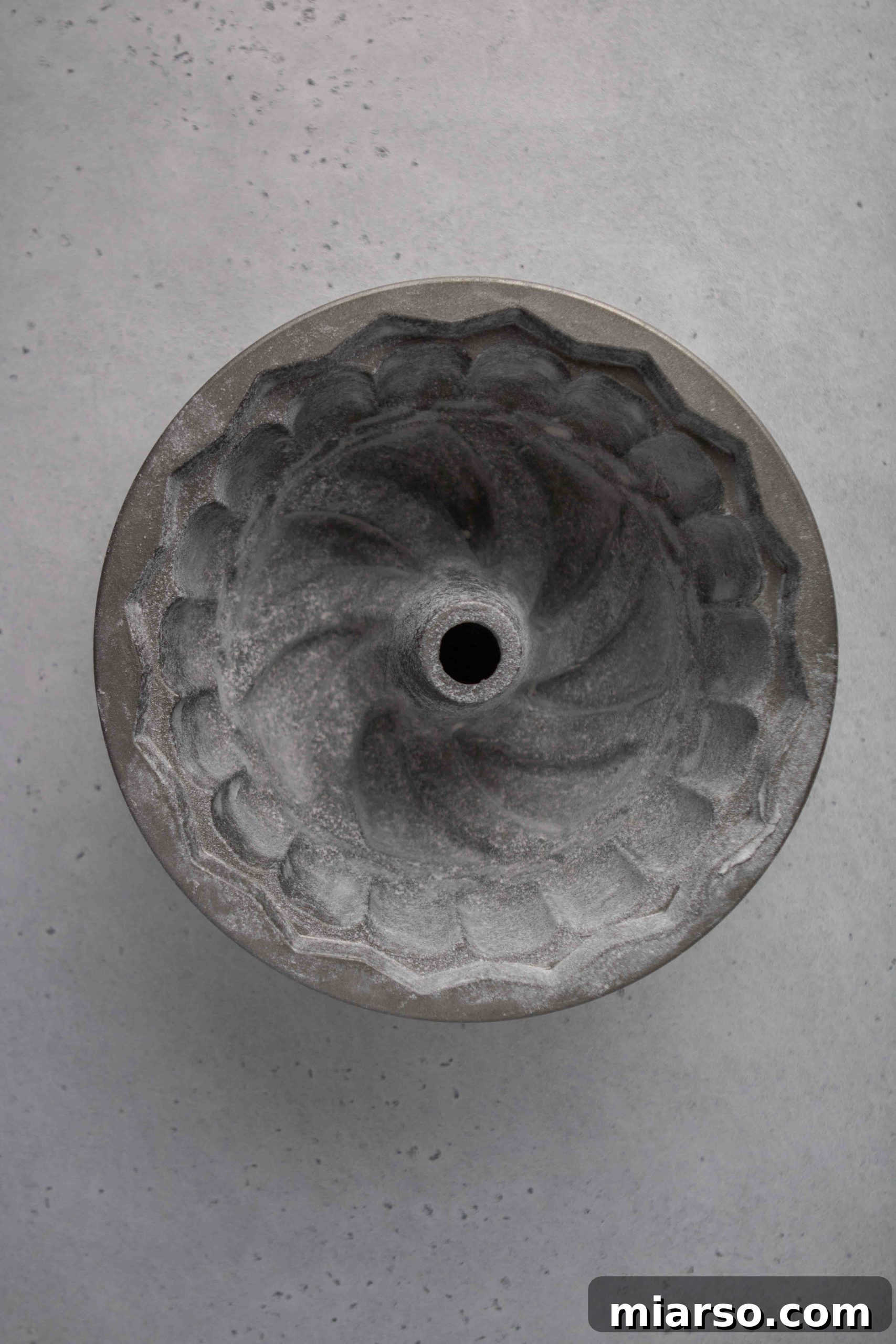 Greasing a bundt cake pan thoroughly