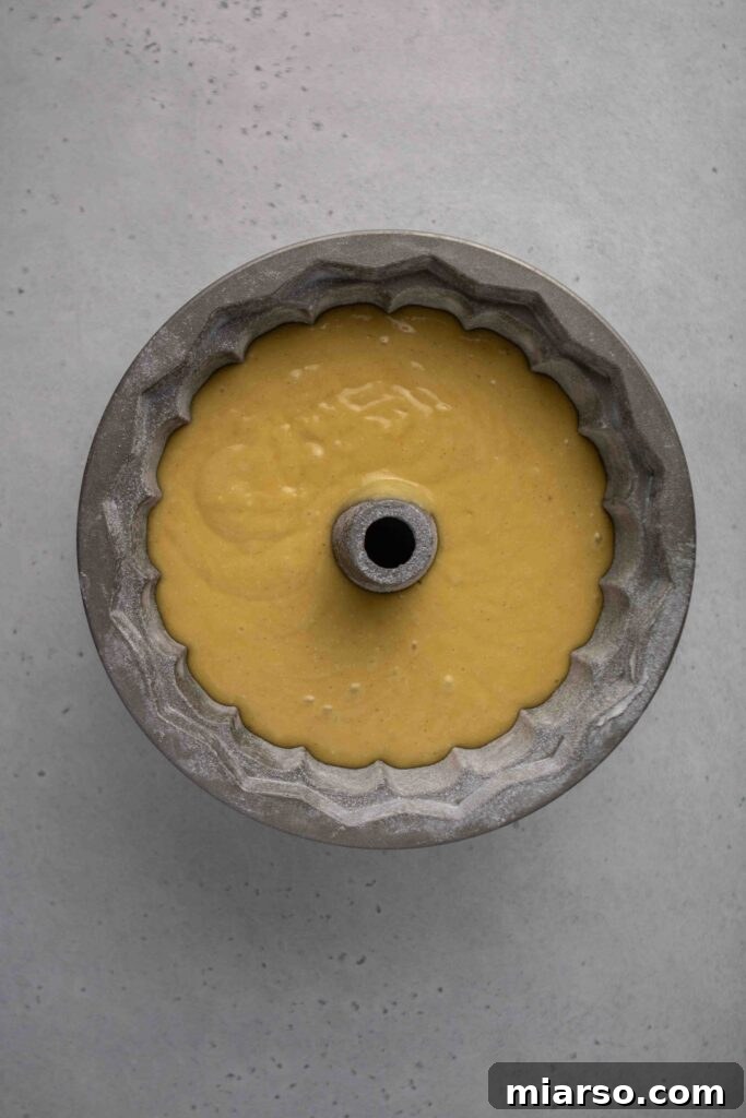 Tips to get bundt cake out of the pan, demonstrating flour dusting