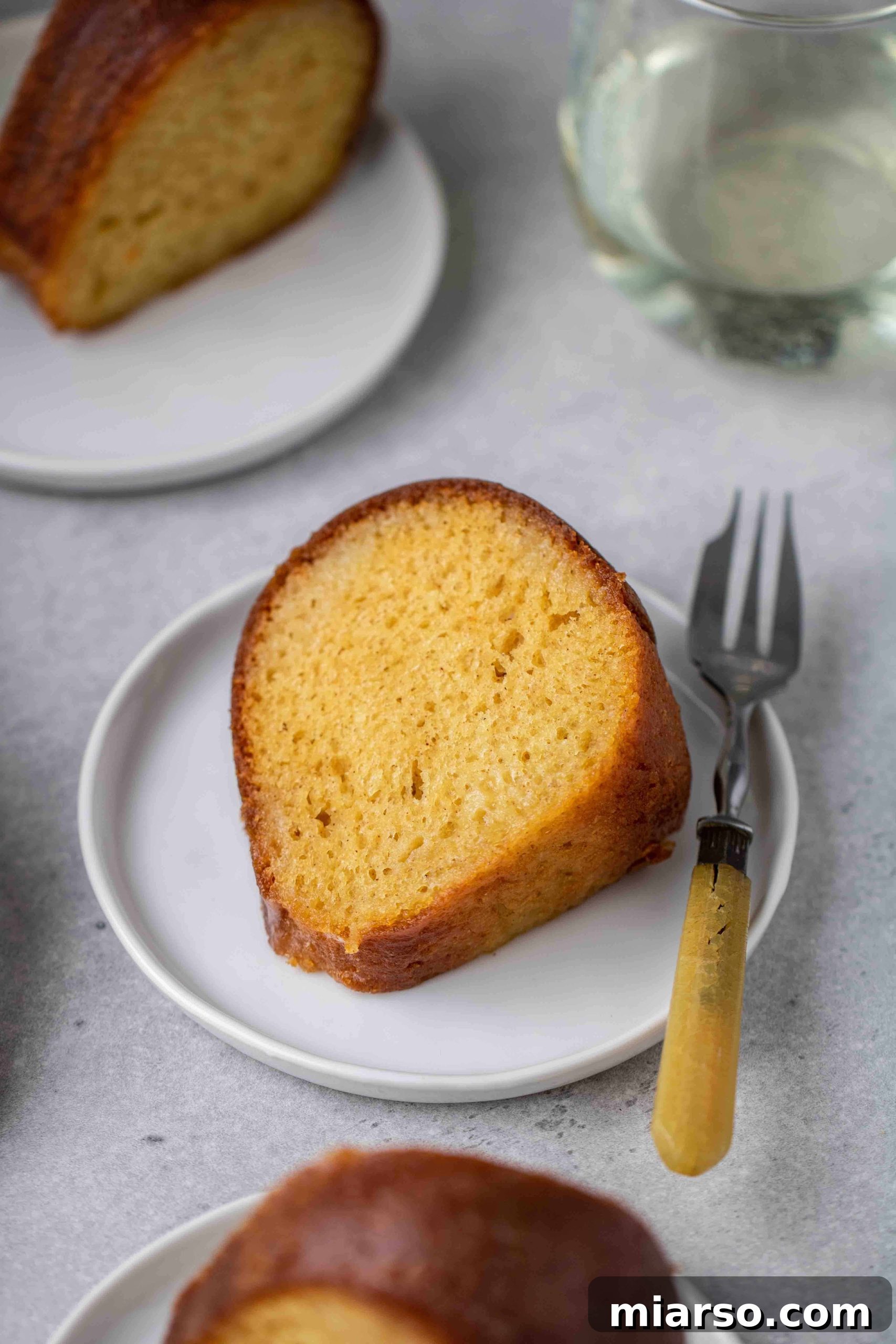 Slice of butter cake bundt cake with wine syrup
