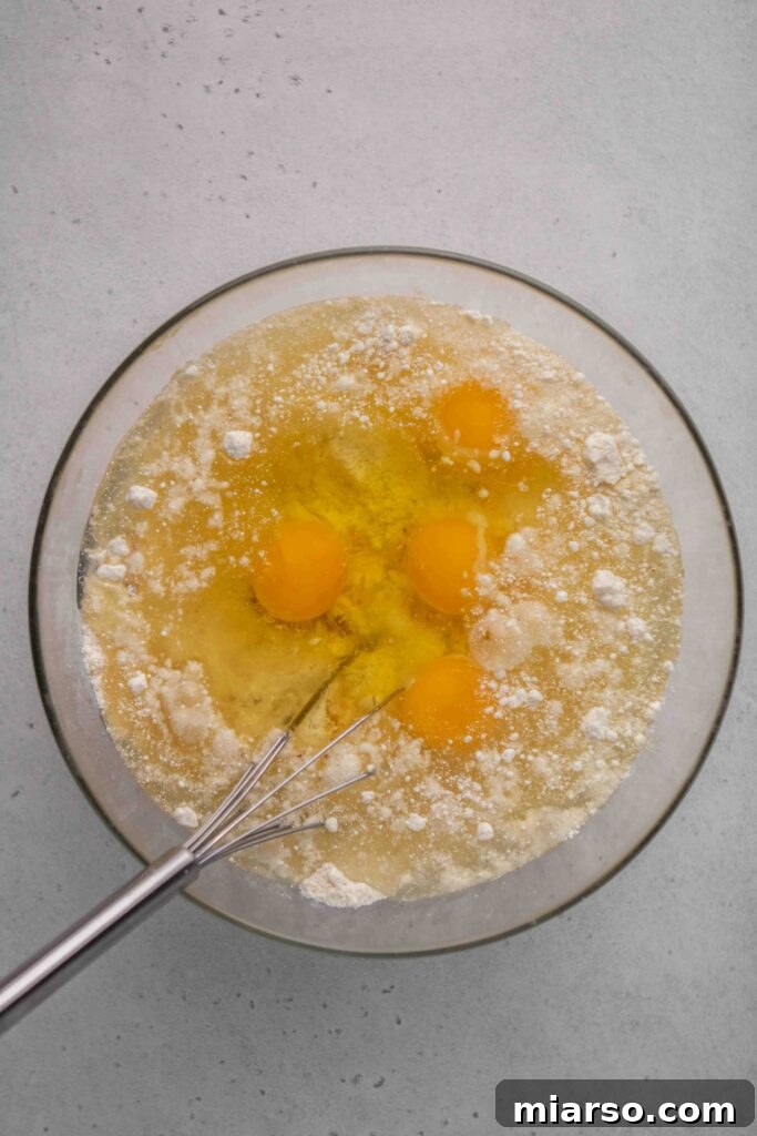 Step by step to make crack cake, pouring batter into bundt pan