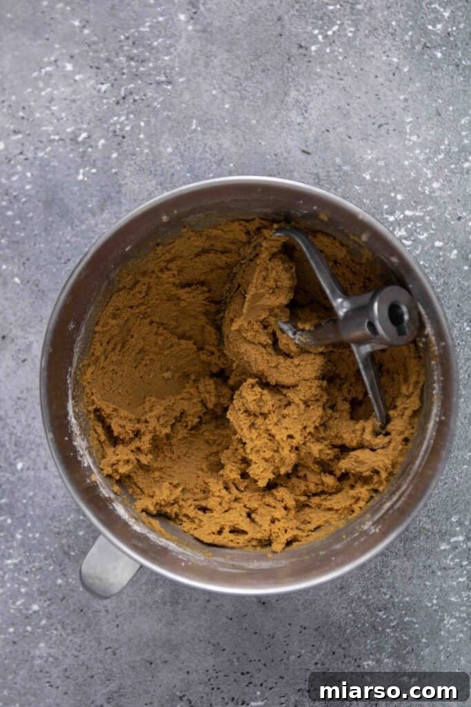 Perfectly Soft and Chewy Ginger Molasses Cookies 10 Step 6: Rolling cookie dough in granulated sugar