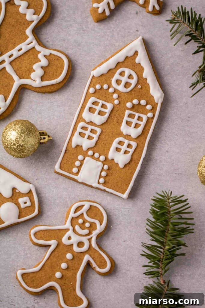 Gingerbread house cutout cookies ready for decorating