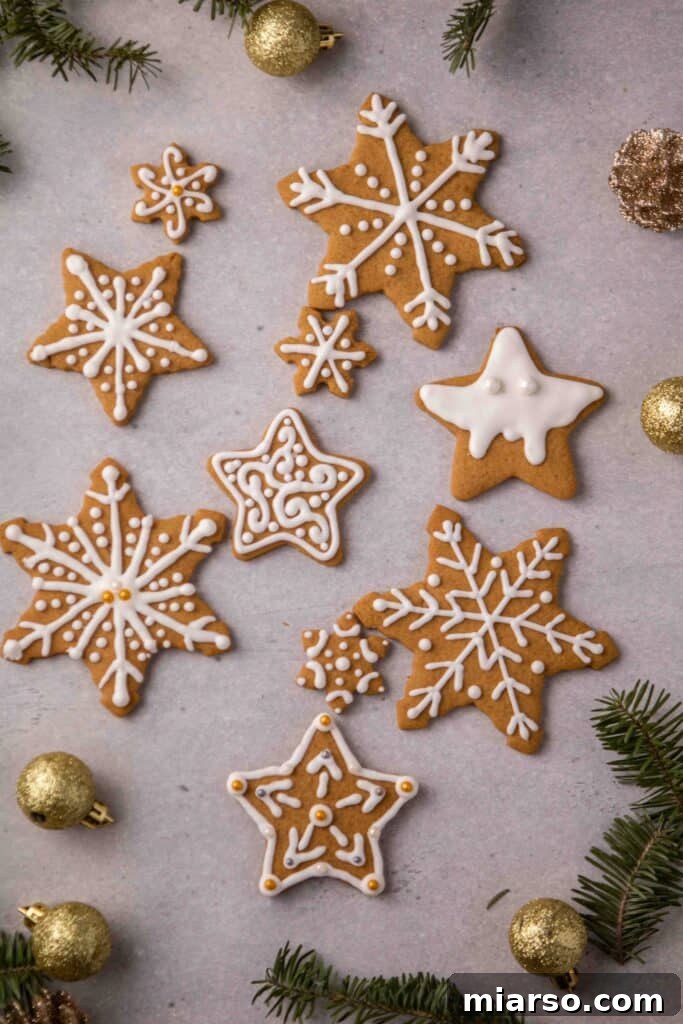 Star-shaped gingerbread cookies with festive decorations