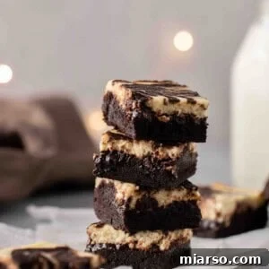 Stack of perfectly chewy cream cheese brownies