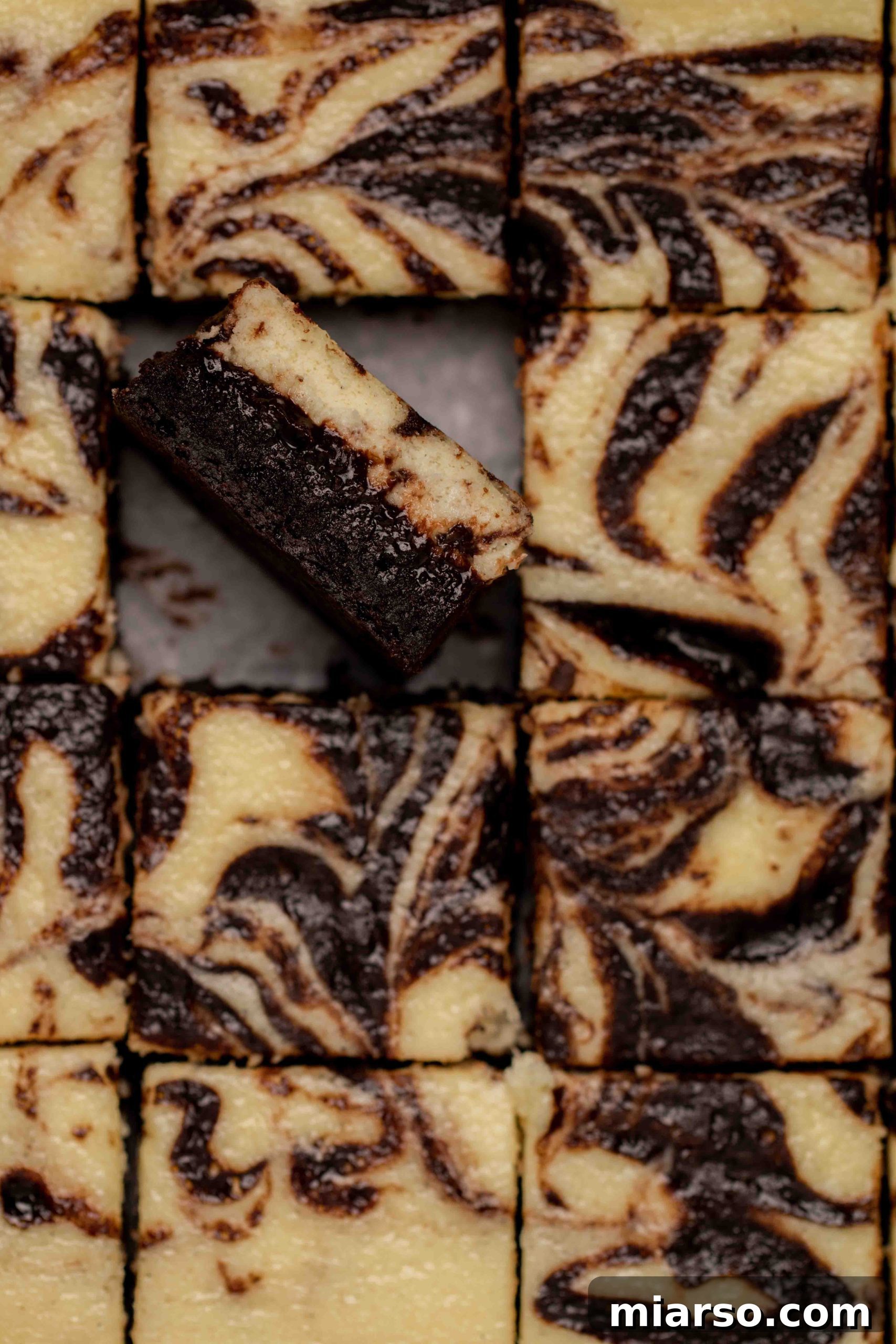 Overhead close up shot of cream cheese brownies, showing the delightful swirl pattern