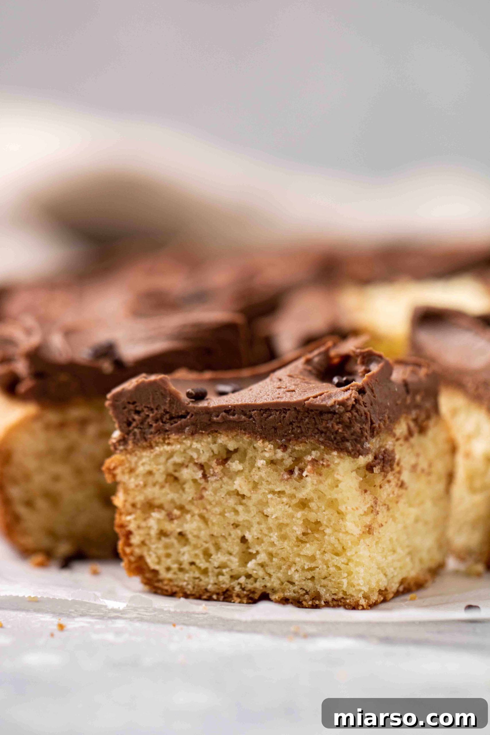 A perfectly frosted slice of vanilla boxed pancake cake.
