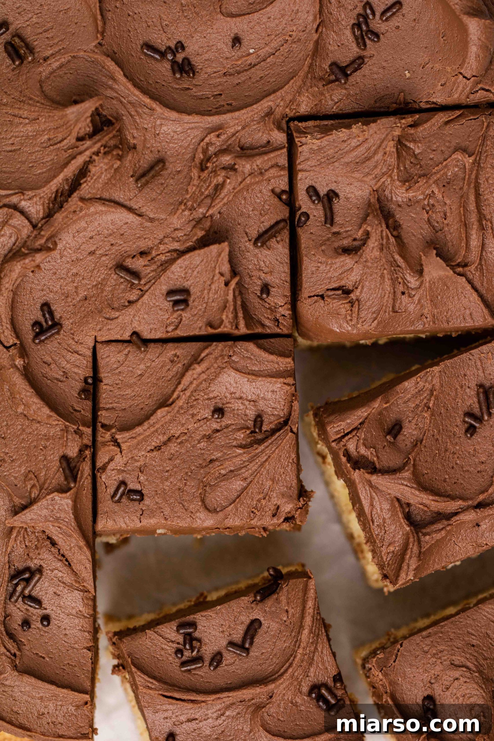 Overhead shot photography of rich chocolate frosting, perfect for topping a pancake mix cake.